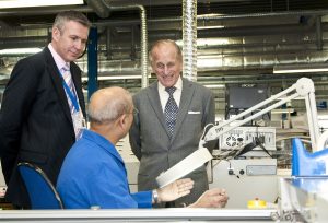 Prince Philip and Speedoard MD speaking with factory operator